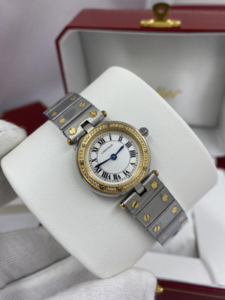 Montre Cartier Santos Ronde
Très bon état
Argenté, Or et acier