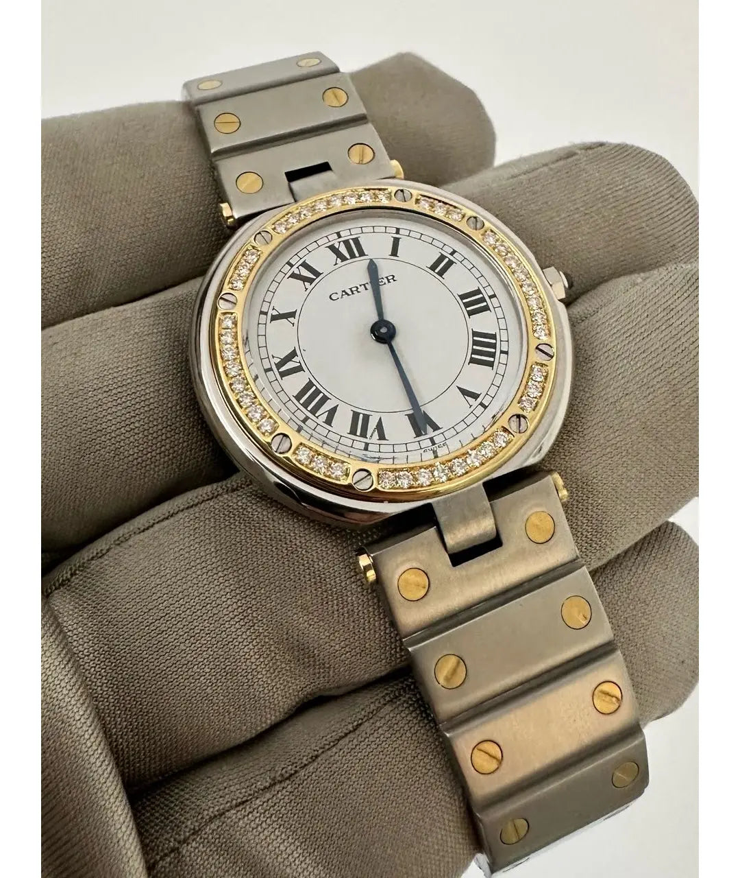Montre  Cartier Santos Ronde
Très bon état
Argenté, Or et acier